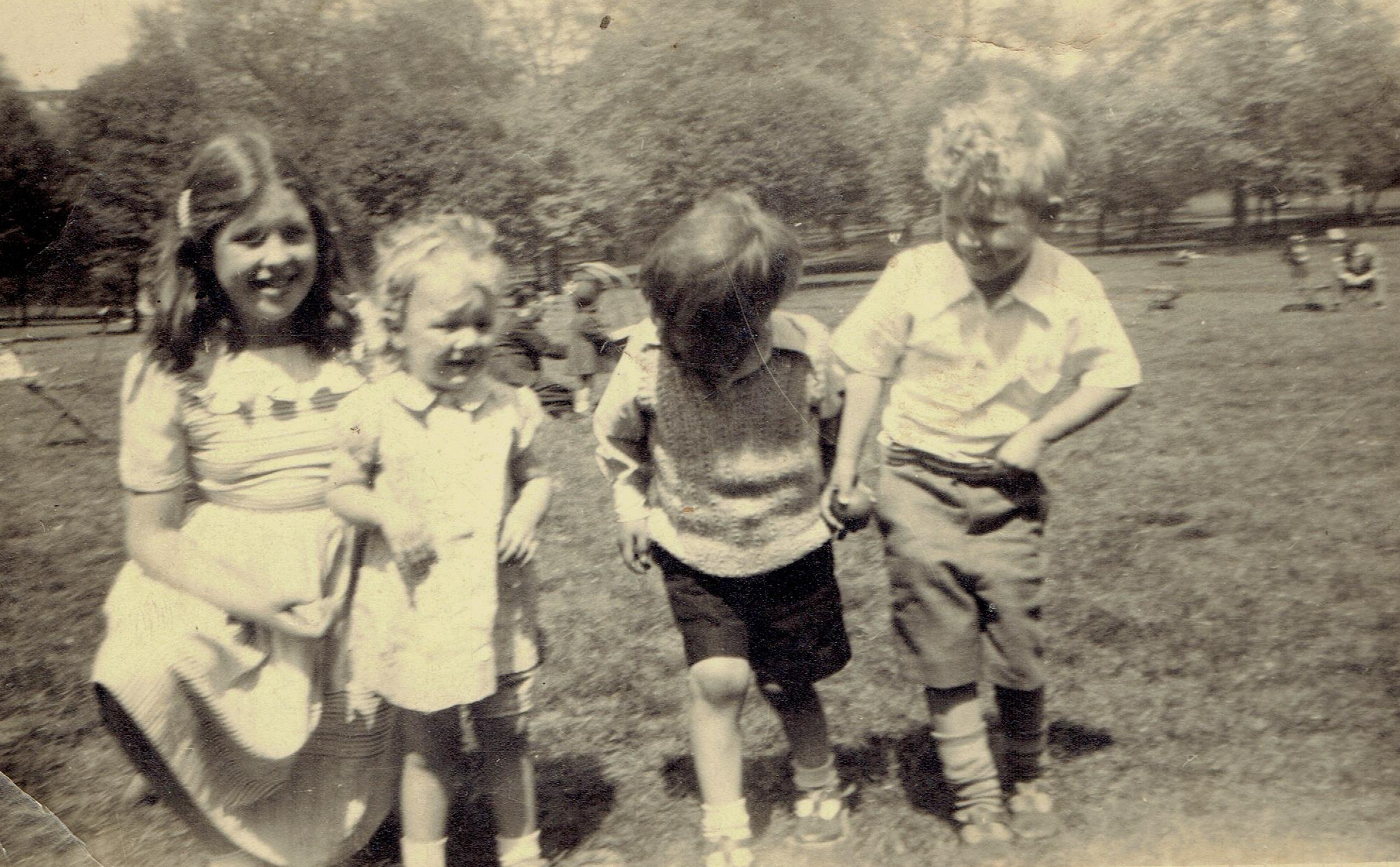 4 children face the camera but James Adcock looks away, again.