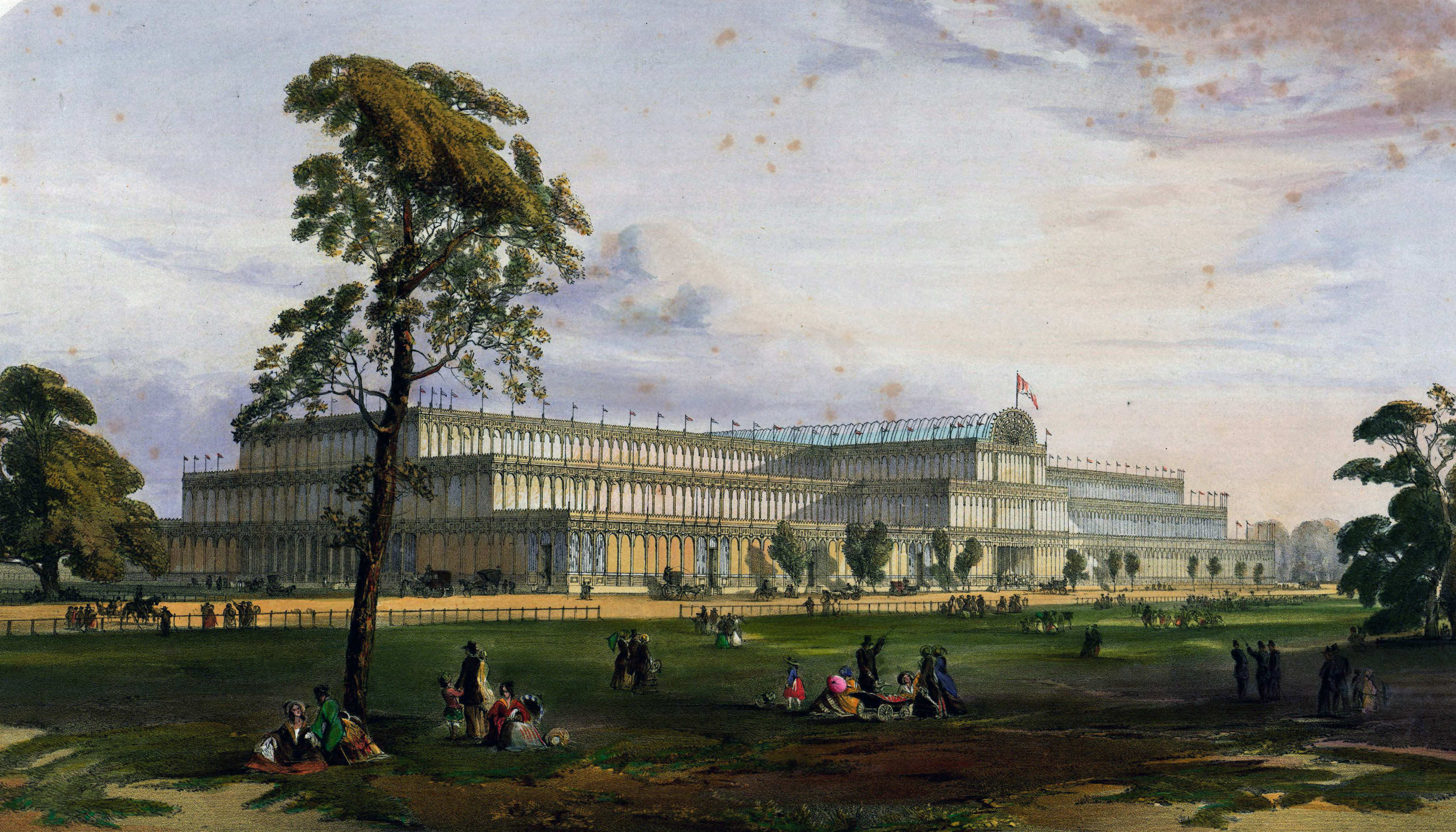 An image of the Crystal Palace showing the front image with people lying on the grass and under trees in the foreground.